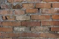 Old dilapidated red brick wall. Royalty Free Stock Photo