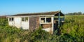 Old dilapidated small shed in a rural area