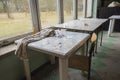 Old, dilapidated tables and coffee tables in an abandoned building. Urbex Royalty Free Stock Photo