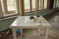 Old, dilapidated tables and coffee tables in an abandoned building. Urbex Royalty Free Stock Photo