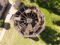 old dilapidated water tower aerial photo in the daytime summer