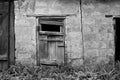 old dilapidated wooden door in a brick building