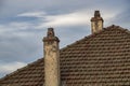 Old Dilipidated Chimney Pots on Tiled Roof Royalty Free Stock Photo