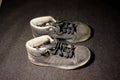 Old dirty adidas kid shoes Royalty Free Stock Photo