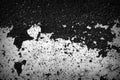 Old dirty asphalt surface with white paint on it. Top view black and white Royalty Free Stock Photo