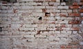 Old dirty brick wall with peeling white paint Royalty Free Stock Photo