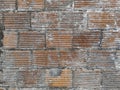 Close-up. Old dirty brick wall texture background. Red brick and cement wall background. French West Indies. Martinique. Royalty Free Stock Photo