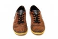 Old dirty brown leather shoes on an isolated white background. Concept, second hand, hard work, walking, worn out pair Royalty Free Stock Photo