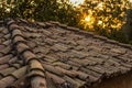 Old dirty brown shingle house soft focus roof outdoor in evening sunset time with sun rays background, rural environment Royalty Free Stock Photo