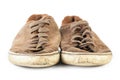 Old dirty brown sneakers, isolated on white background Royalty Free Stock Photo