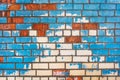 Old dirty colored brick wall texture with blue peeling paint background Royalty Free Stock Photo