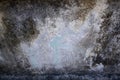 Gray and white concrete wall with black mildew stains grunge background