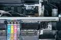 Old, dirty, disassembled ink jet printer. View of internal parts.