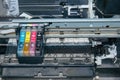 Old, dirty, disassembled ink jet printer. View of internal parts.