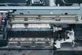 Old, dirty, disassembled ink jet printer. View of internal parts.