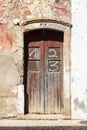 Old and dirty entry-door of an abandoned house in Portugal Royalty Free Stock Photo