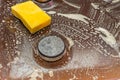 Old dirty gas stove with surface in kitchen from cooking oil stains and with cleaning chemical foam that dissolve dirt, fats. Royalty Free Stock Photo