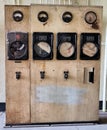 Old dirty industrial control panel of measuring gauges