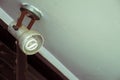 Old dirty light bulb hanging on ceiling Royalty Free Stock Photo