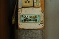 Old and dirty light switch on grunge wall background