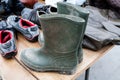 Old dirty pair of gumboots with sneakers