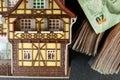 Old and dirty plastic house model put beside banknote. Royalty Free Stock Photo