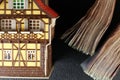 Old and dirty plastic house model put beside banknote. Royalty Free Stock Photo