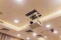 Old and dirty projector hang on ceiling in meeting room, education concept. Royalty Free Stock Photo