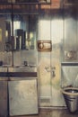 Old dirty public toilet with metallic interior Royalty Free Stock Photo