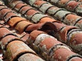 Old dirty roof with misplaced tile middle Royalty Free Stock Photo