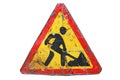 Old dirty rusty triangular road sign `Under construction`. Royalty Free Stock Photo