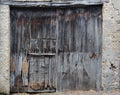 Old, dirty and weathered closed wooden barn door Royalty Free Stock Photo