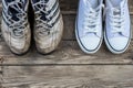 Old dirty worn and new unworn sneakers Royalty Free Stock Photo