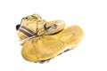 Old dirty yellow football shoes damaged on white background football object isolated