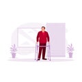 An old disabled man was learning to walk using a walker. Concept of physical activity training. Royalty Free Stock Photo