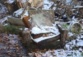 An old discarded chair is dusted with snow Royalty Free Stock Photo