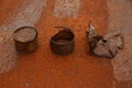 Old discarded rusty cans on a metal surface. Decomposition process. Place for text. Selective focus. Concept - Long decaying waste Royalty Free Stock Photo