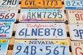 Old discontinued car license plates or vehicle registration numbers from different USA states such as California, Nevada Royalty Free Stock Photo
