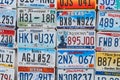 Old discontinued car license plates or vehicle registration numbers from different USA states such as Texas, Oklahoma Royalty Free Stock Photo