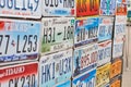 Old discontinued car license plates or vehicle registration numbers from different USA states such as Texas, Oklahoma