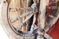 Old distaff spinning wheel in the yard of a country house. The concept of preservation of traditional crafts, obsolete technologie