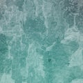 Old distressed grunge background texture in white grungy and crackled paint, weathered vintage backdrop in blue green hue Royalty Free Stock Photo