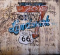 Old Distressed Plywood Sign Route 66 with Graffiti