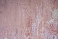 Old distressed wall with pink peeling plaster Royalty Free Stock Photo