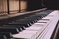 Old disused piano with damaged keys Vintage Retro Filter. Royalty Free Stock Photo