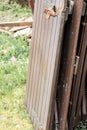 Old, disused wooden slats piled up outside the house. Useless stuff. Royalty Free Stock Photo