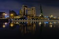 Old dock in Ghent, with industrial silo`s and cranes, at night Royalty Free Stock Photo