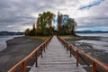 Old dock linking to an isolated island, ChiloÃÂ© Is Royalty Free Stock Photo