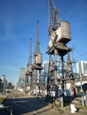 Old Dockside Cranes Located in Redeveloped Docklands Royalty Free Stock Photo