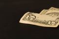 Old 5 dollar bill on dark background. Close up. The concept of saving money